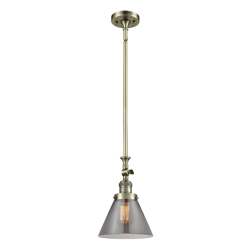 Cone Mini Pendant shown in the Antique Brass finish with a Plated Smoke shade