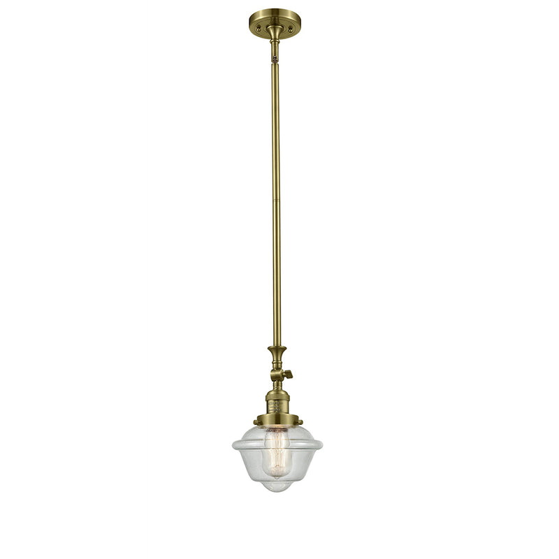 Oxford Mini Pendant shown in the Antique Brass finish with a Seedy shade