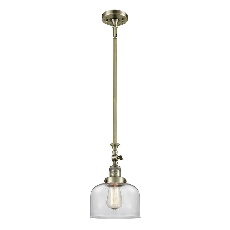 Bell Mini Pendant shown in the Antique Brass finish with a Clear shade