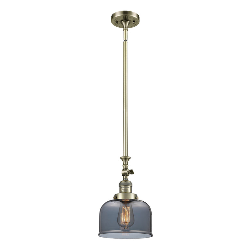 Bell Mini Pendant shown in the Antique Brass finish with a Plated Smoke shade