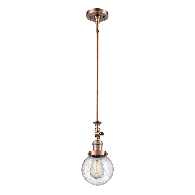 Beacon Mini Pendant shown in the Antique Copper finish with a Seedy shade