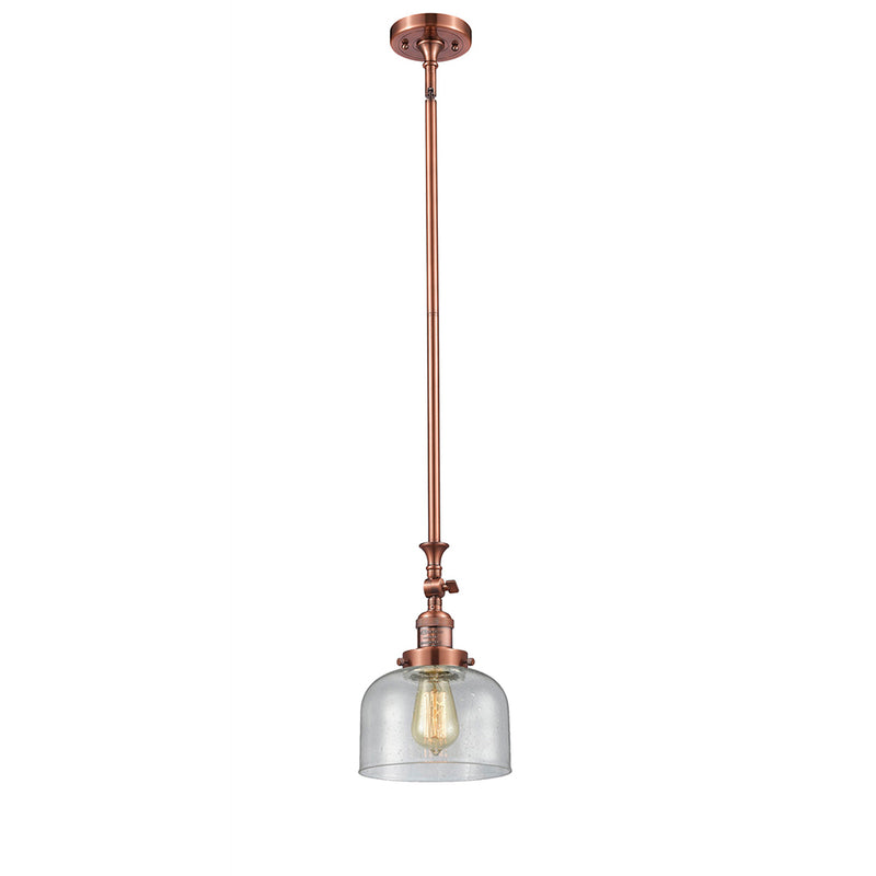 Bell Mini Pendant shown in the Antique Copper finish with a Seedy shade