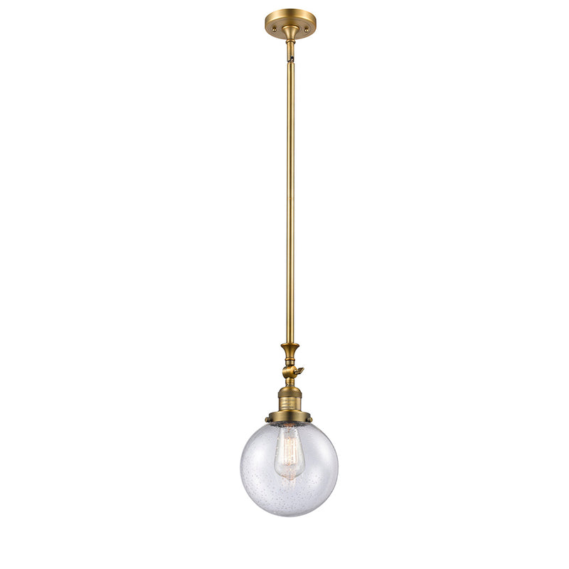 Beacon Mini Pendant shown in the Brushed Brass finish with a Seedy shade