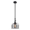 Bell Cage Mini Pendant shown in the Matte Black finish with a Plated Smoke shade