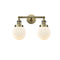 Beacon Bath Vanity Light shown in the Antique Brass finish with a Matte White shade