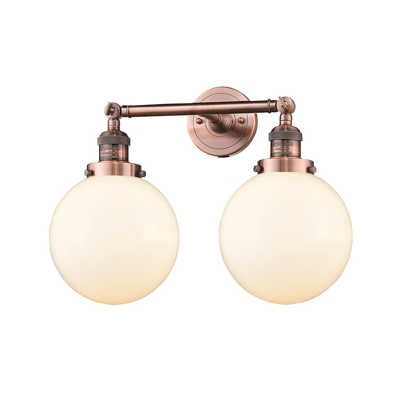 Beacon Bath Vanity Light shown in the Antique Copper finish with a Matte White shade