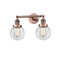 Beacon Bath Vanity Light shown in the Antique Copper finish with a Clear shade