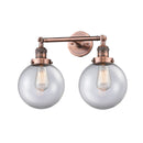 Beacon Bath Vanity Light shown in the Antique Copper finish with a Clear shade