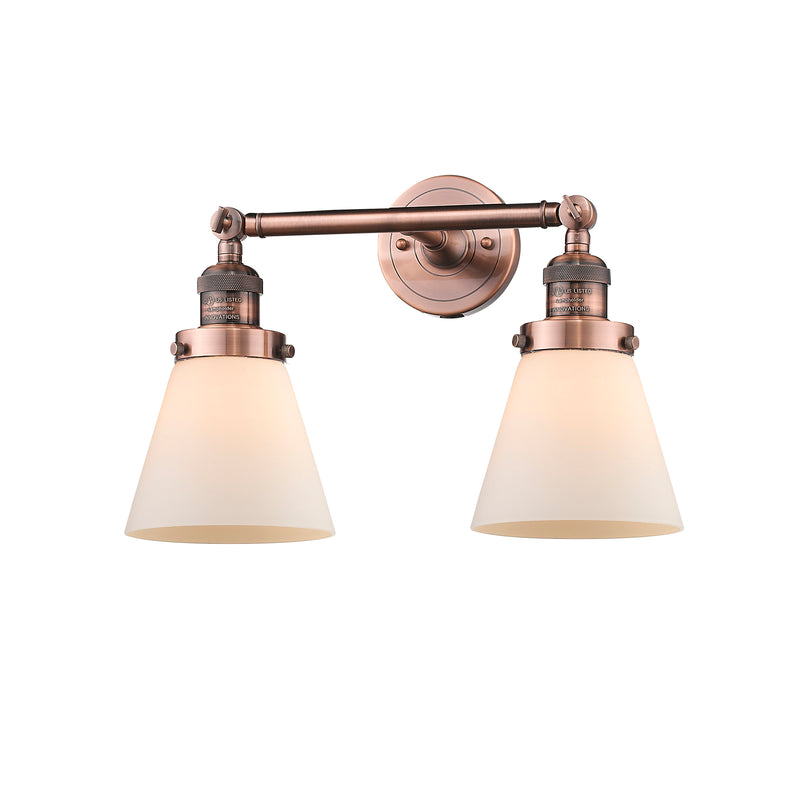 Cone Bath Vanity Light shown in the Antique Copper finish with a Matte White shade