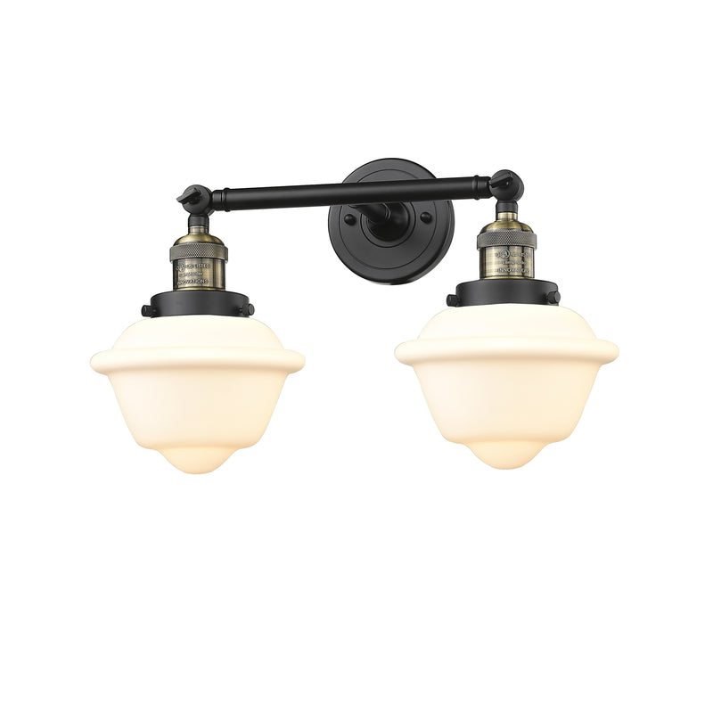 Oxford Bath Vanity Light shown in the Black Antique Brass finish with a Matte White shade