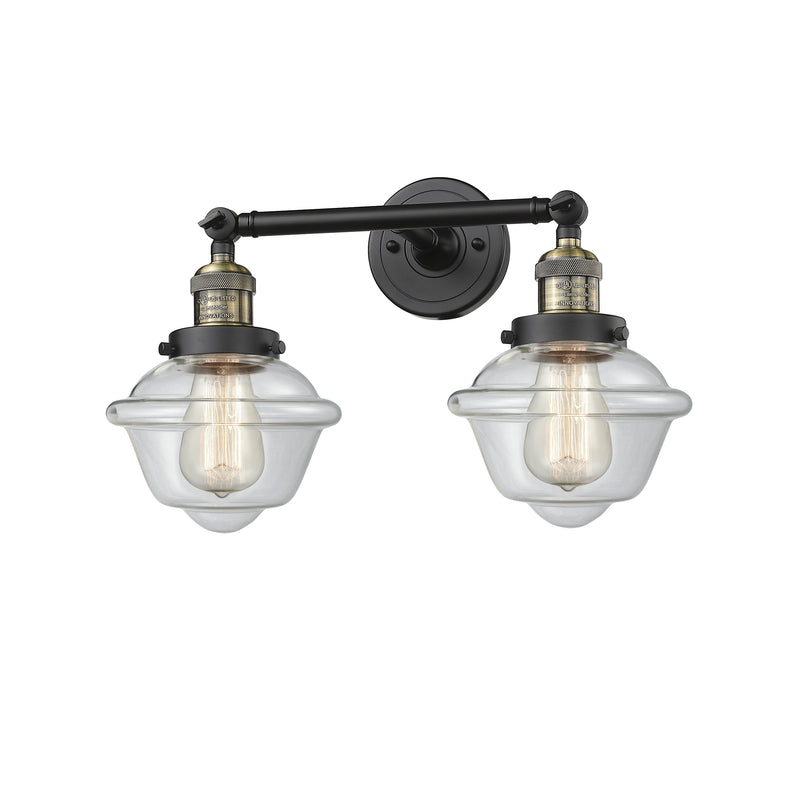 Oxford Bath Vanity Light shown in the Black Antique Brass finish with a Clear shade