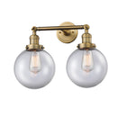 Beacon Bath Vanity Light shown in the Brushed Brass finish with a Clear shade