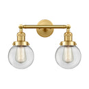 Beacon Bath Vanity Light shown in the Satin Gold finish with a Clear shade