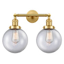 Beacon Bath Vanity Light shown in the Satin Gold finish with a Clear shade