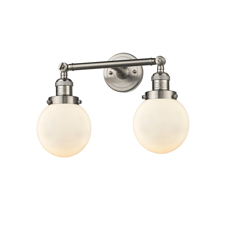 Beacon Bath Vanity Light shown in the Brushed Satin Nickel finish with a Matte White shade