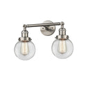 Beacon Bath Vanity Light shown in the Brushed Satin Nickel finish with a Clear shade