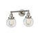 Beacon Bath Vanity Light shown in the Brushed Satin Nickel finish with a Clear shade