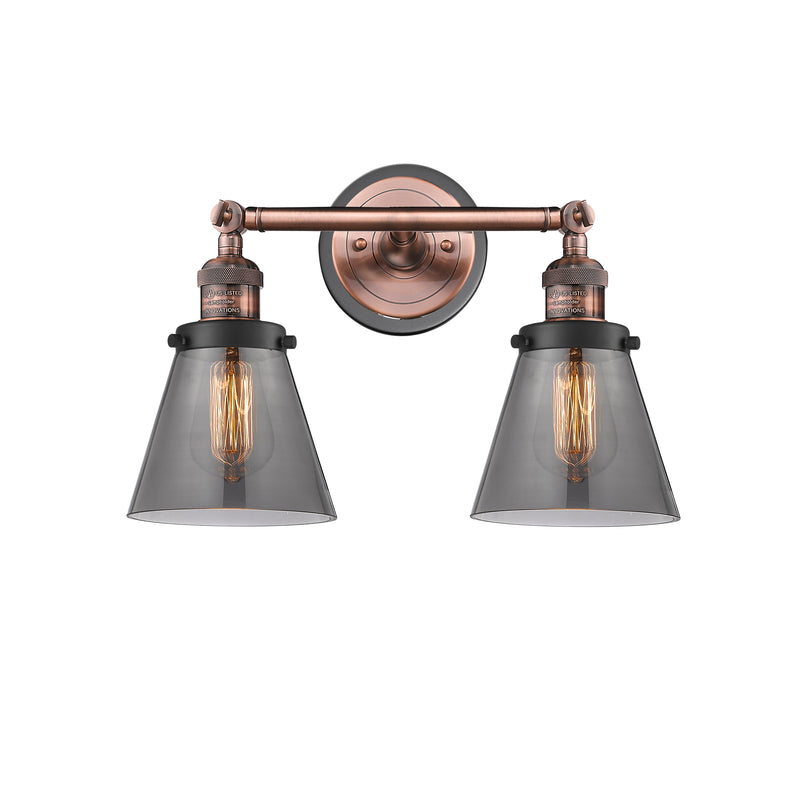 Cone Bath Vanity Light shown in the Antique Copper finish with a Plated Smoke shade