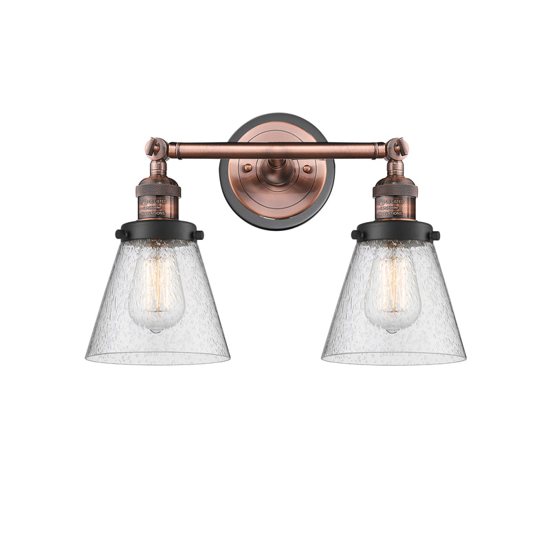 Cone Bath Vanity Light shown in the Antique Copper finish with a Seedy shade