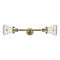 Bellmont Bath Vanity Light shown in the Antique Brass finish with a Clear shade