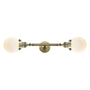 Beacon Bath Vanity Light shown in the Antique Brass finish with a Matte White shade