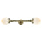 Beacon Bath Vanity Light shown in the Antique Brass finish with a Matte White shade