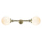 Beacon Bath Vanity Light shown in the Antique Brass finish with a Matte White shade