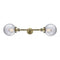 Beacon Bath Vanity Light shown in the Antique Brass finish with a Clear shade