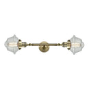 Oxford Bath Vanity Light shown in the Antique Brass finish with a Seedy shade