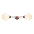 Beacon Bath Vanity Light shown in the Antique Copper finish with a Matte White shade