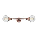 Beacon Bath Vanity Light shown in the Antique Copper finish with a Clear shade