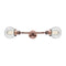 Beacon Bath Vanity Light shown in the Antique Copper finish with a Clear shade