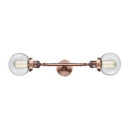 Beacon Bath Vanity Light shown in the Antique Copper finish with a Clear shade