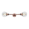 Beacon Bath Vanity Light shown in the Antique Copper finish with a Clear shade