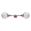 Beacon Bath Vanity Light shown in the Antique Copper finish with a Clear shade