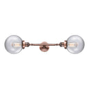 Beacon Bath Vanity Light shown in the Antique Copper finish with a Clear shade