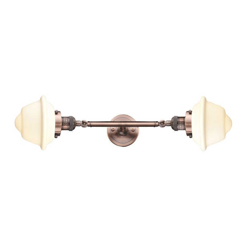 Oxford Bath Vanity Light shown in the Antique Copper finish with a Matte White shade