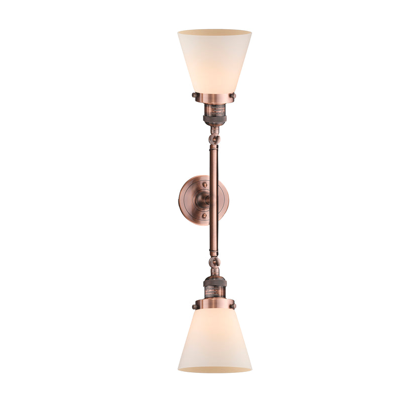 Cone Bath Vanity Light shown in the Antique Copper finish with a Matte White shade