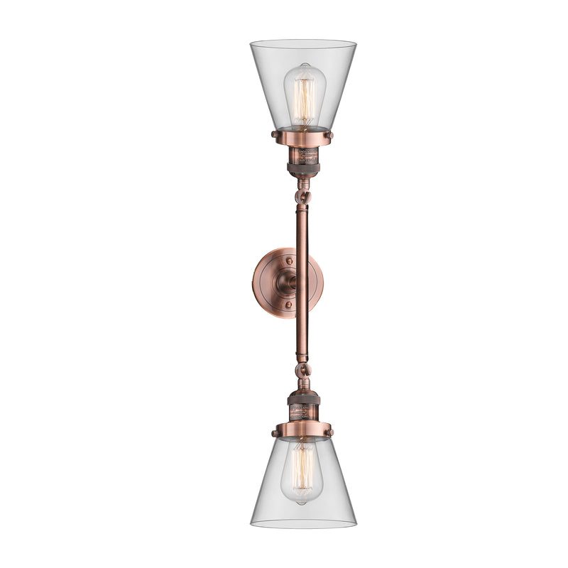 Cone Bath Vanity Light shown in the Antique Copper finish with a Clear shade