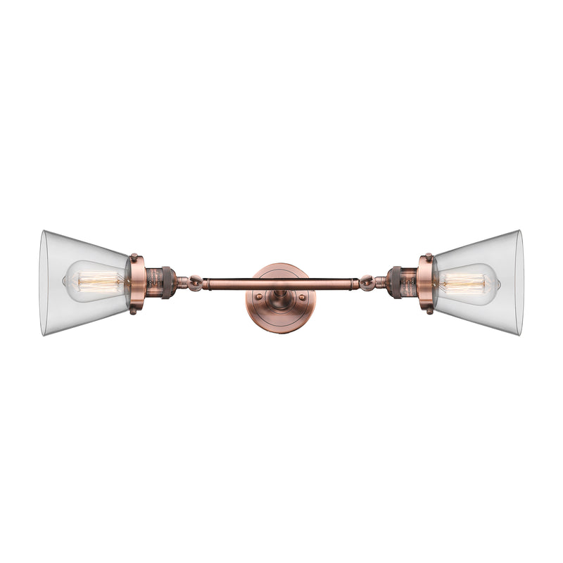 Cone Bath Vanity Light shown in the Antique Copper finish with a Clear shade