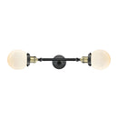 Beacon Bath Vanity Light shown in the Black Antique Brass finish with a Matte White shade