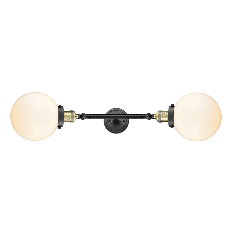 Beacon Bath Vanity Light shown in the Black Antique Brass finish with a Matte White shade