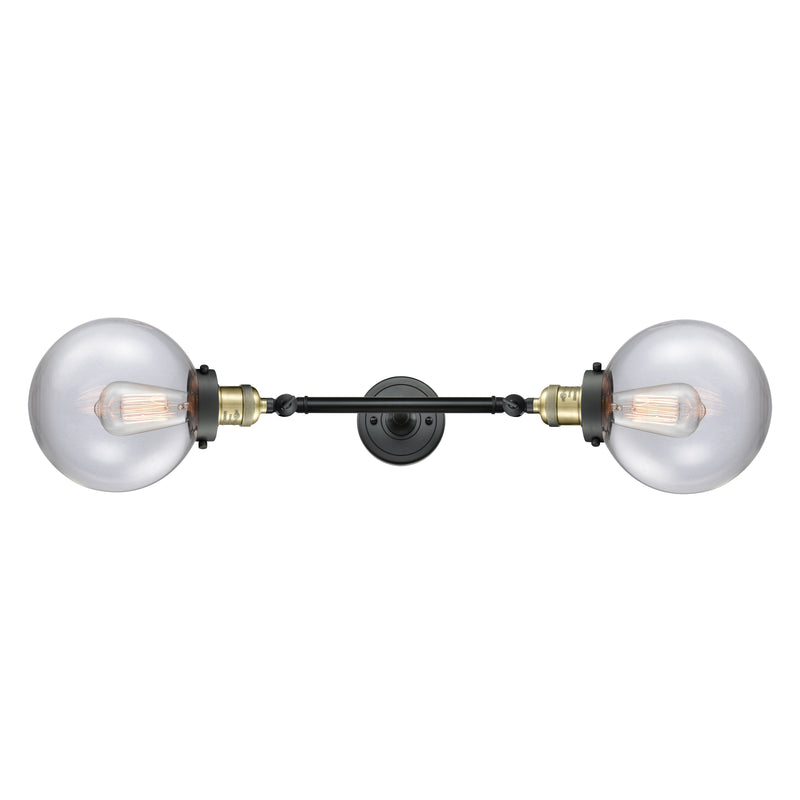 Beacon Bath Vanity Light shown in the Black Antique Brass finish with a Clear shade