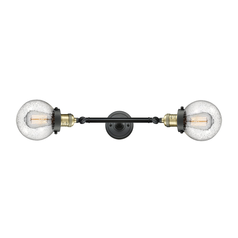 Beacon Bath Vanity Light shown in the Black Antique Brass finish with a Seedy shade