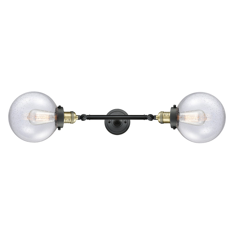 Beacon Bath Vanity Light shown in the Black Antique Brass finish with a Seedy shade