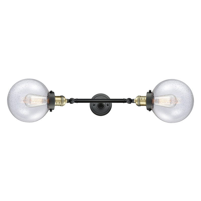 Beacon Bath Vanity Light shown in the Black Antique Brass finish with a Seedy shade