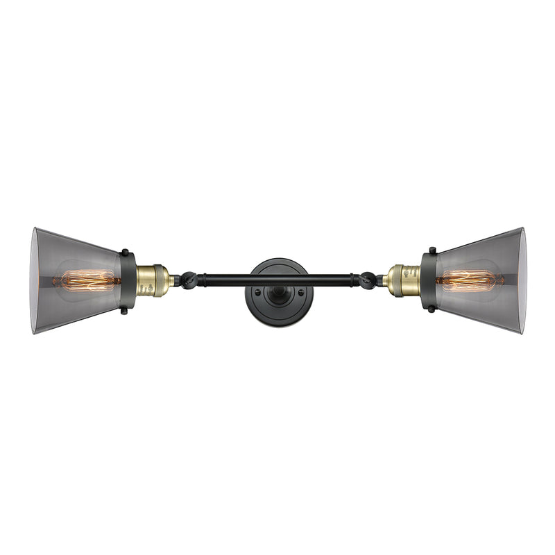 Cone Bath Vanity Light shown in the Black Antique Brass finish with a Plated Smoke shade