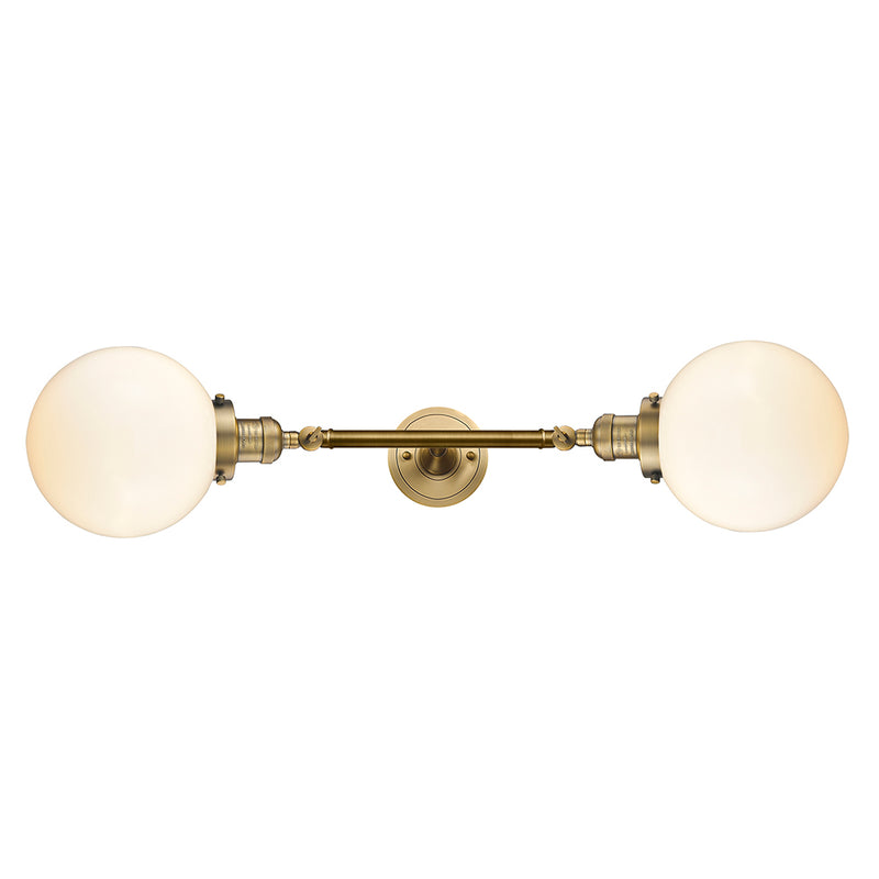 Beacon Bath Vanity Light shown in the Brushed Brass finish with a Matte White shade