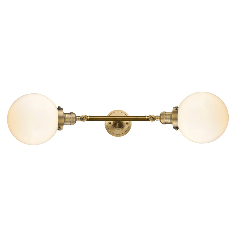 Beacon Bath Vanity Light shown in the Brushed Brass finish with a Matte White shade