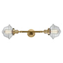 Oxford Bath Vanity Light shown in the Brushed Brass finish with a Clear shade